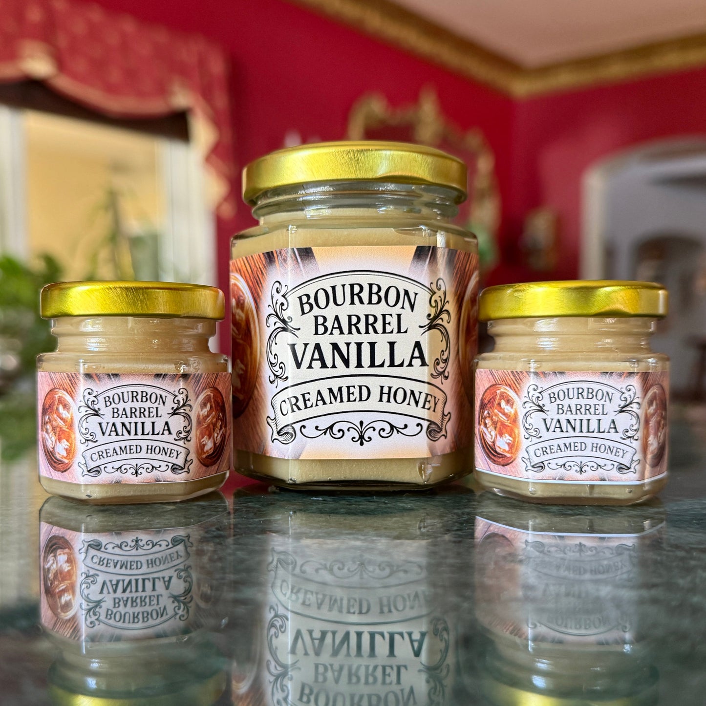 Bourbon Barrel Vanilla Creamed Honey in clear glass jar with ribbon and gold spoon – gourmet gift for bourbon lovers